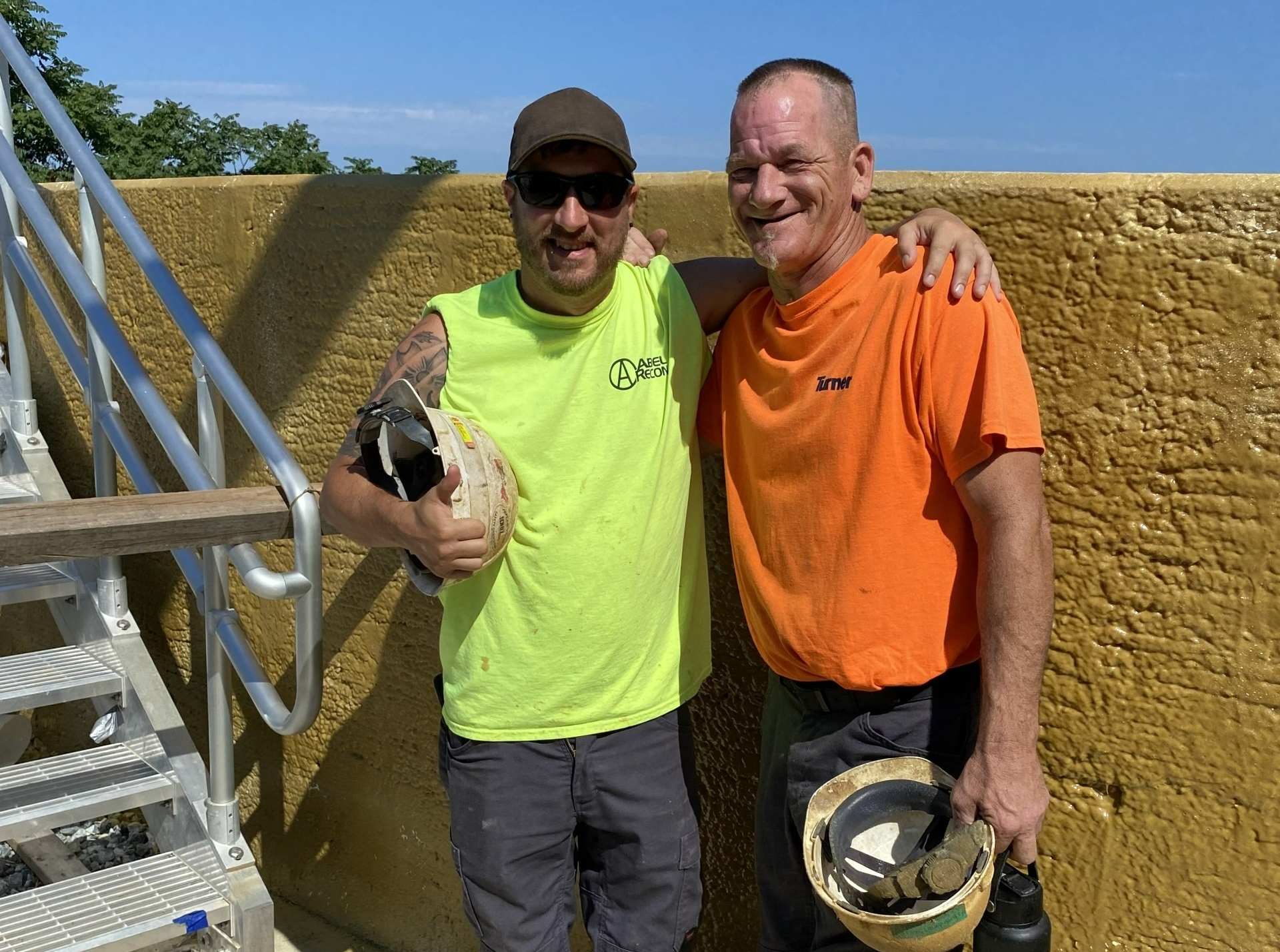 Crew leaders celebrate successful sewer rehabilitation contract
