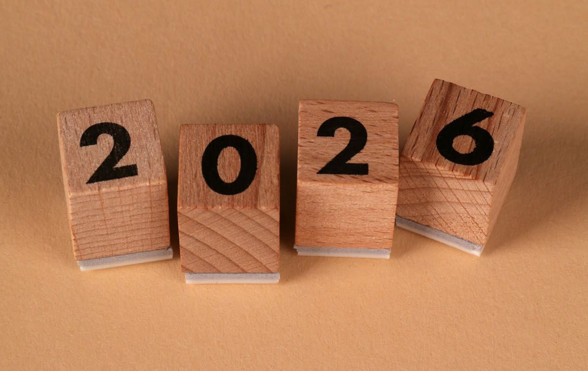 Four wooden blocks arranged to read the year 2026.
