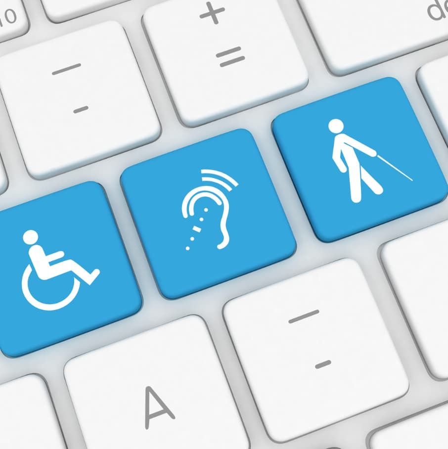 A keyboard with a wheelchair ear and blind person buttons