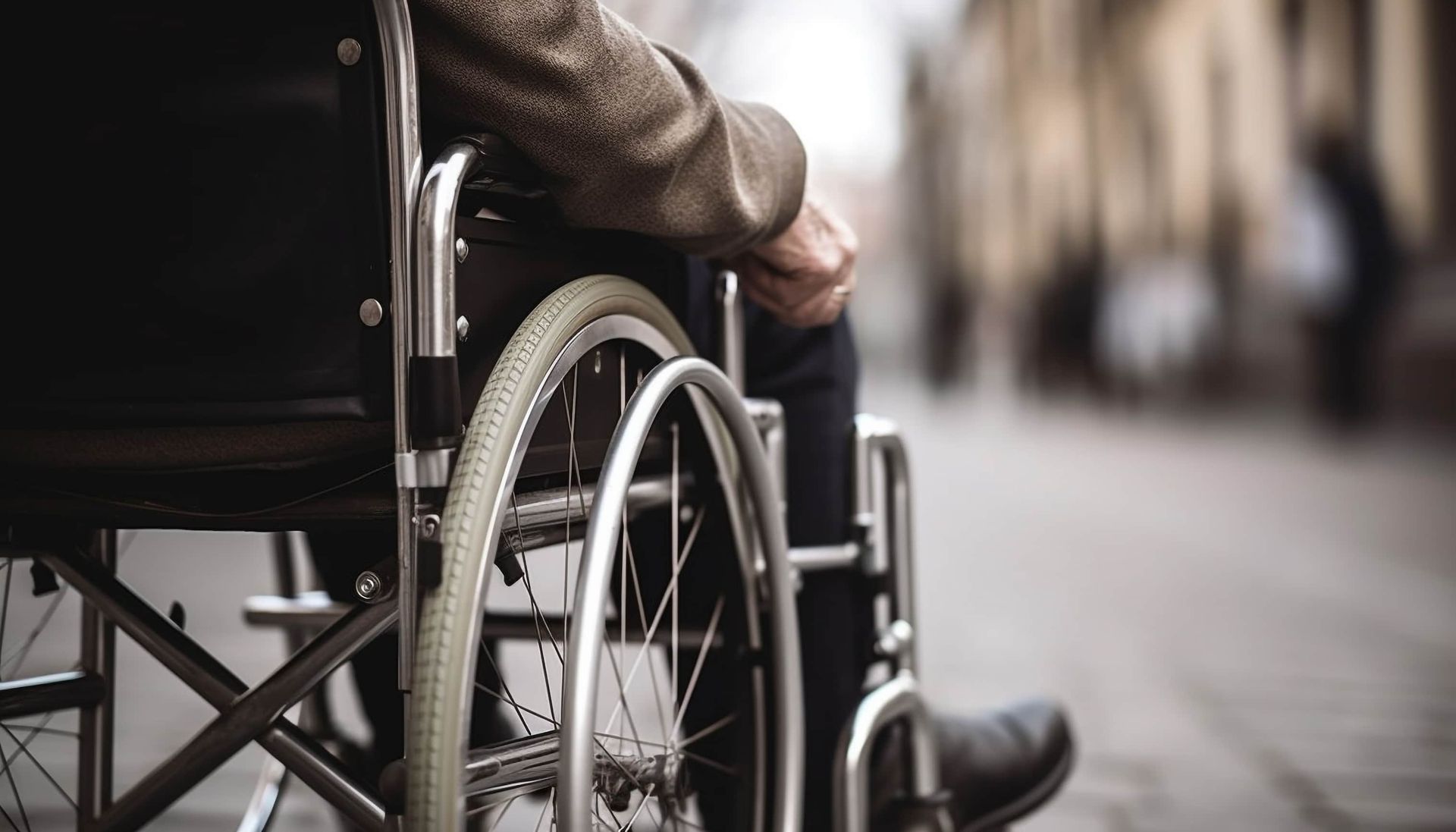 A person wheeling in a wheelchair.