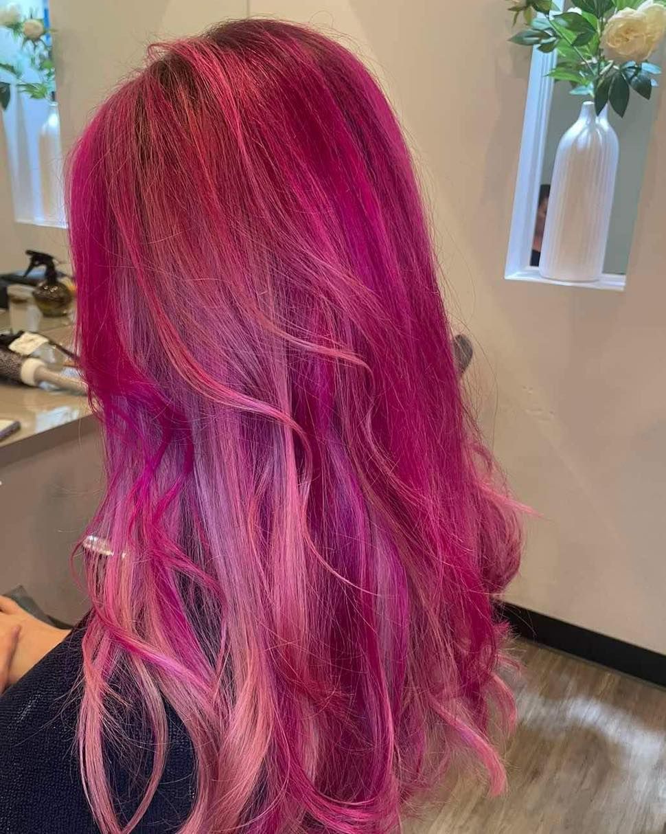 Woman's Hair Dyed Bright Pink, Long and Wavy — Artistry Of Hair in Redlynch, QLD