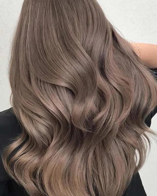 Woman With Wavy, Blonde Ombre Hair, Wearing a Black Sweater — Artistry Of Hair in Redlynch, QLD