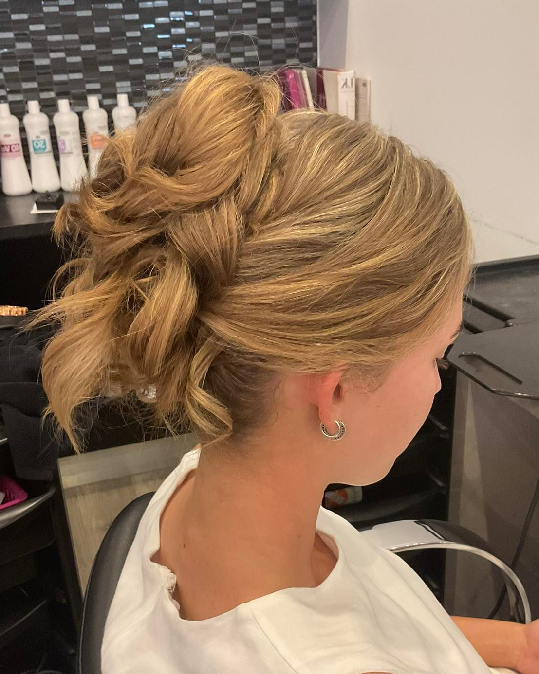 Woman's Wavy Brown Hair With Green Hair Clips, Viewed From the Back — Artistry Of Hair in Redlynch, QLD