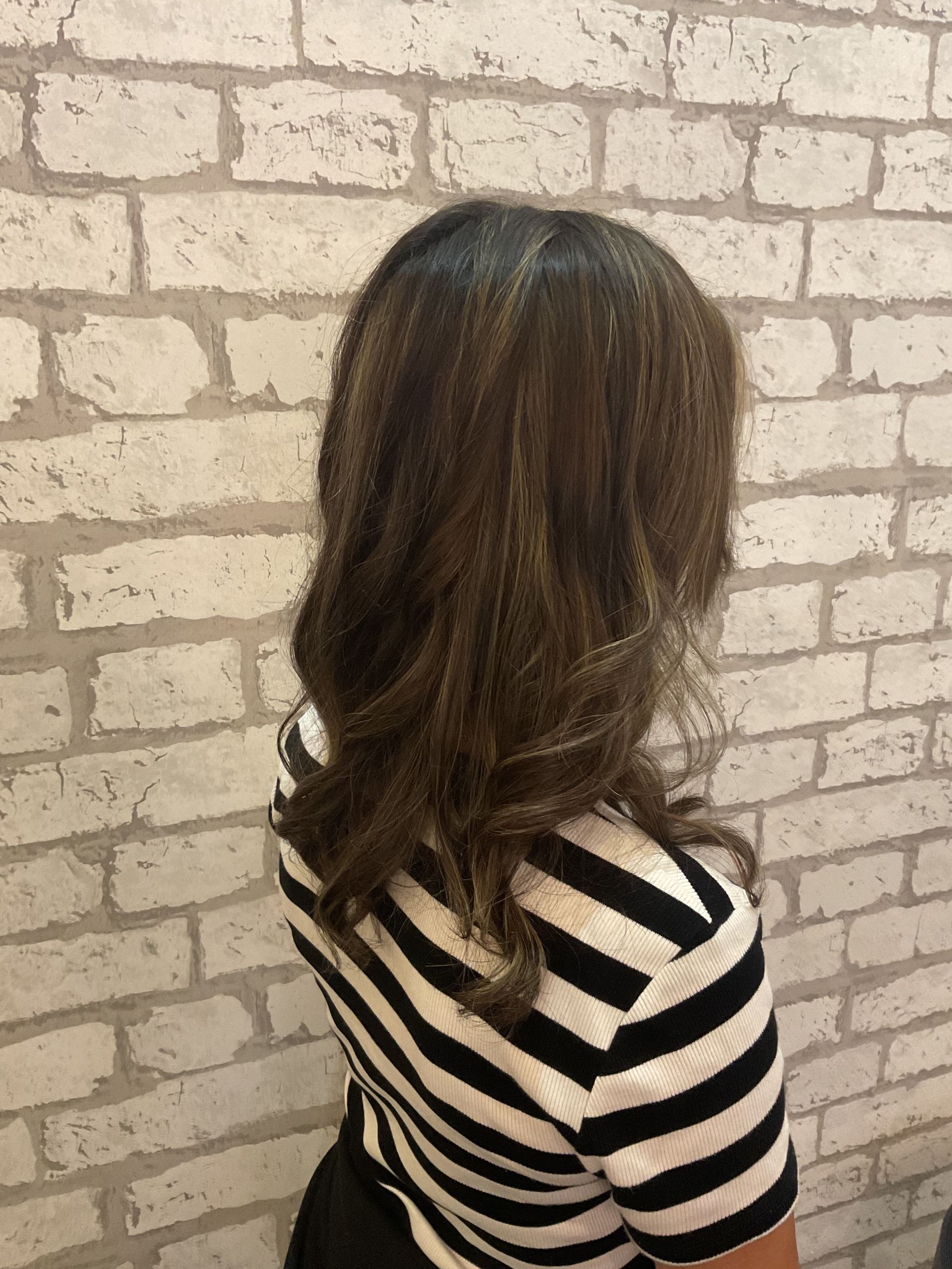 Woman's Long, Brown and Blonde Highlighted Hair at a Salon — Artistry Of Hair in Redlynch, QLD
