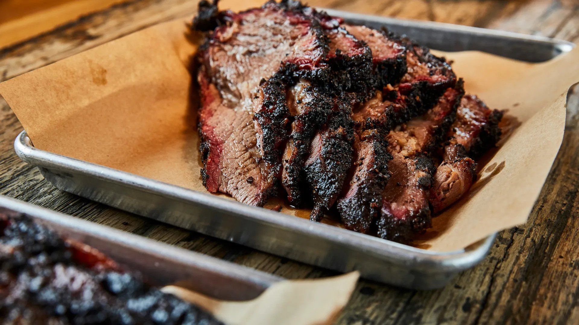 grilled meat served in aluminum pan