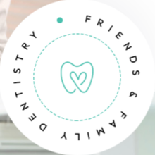 A circular logo featuring a mint-green heart-shaped tooth outline surrounded by the text