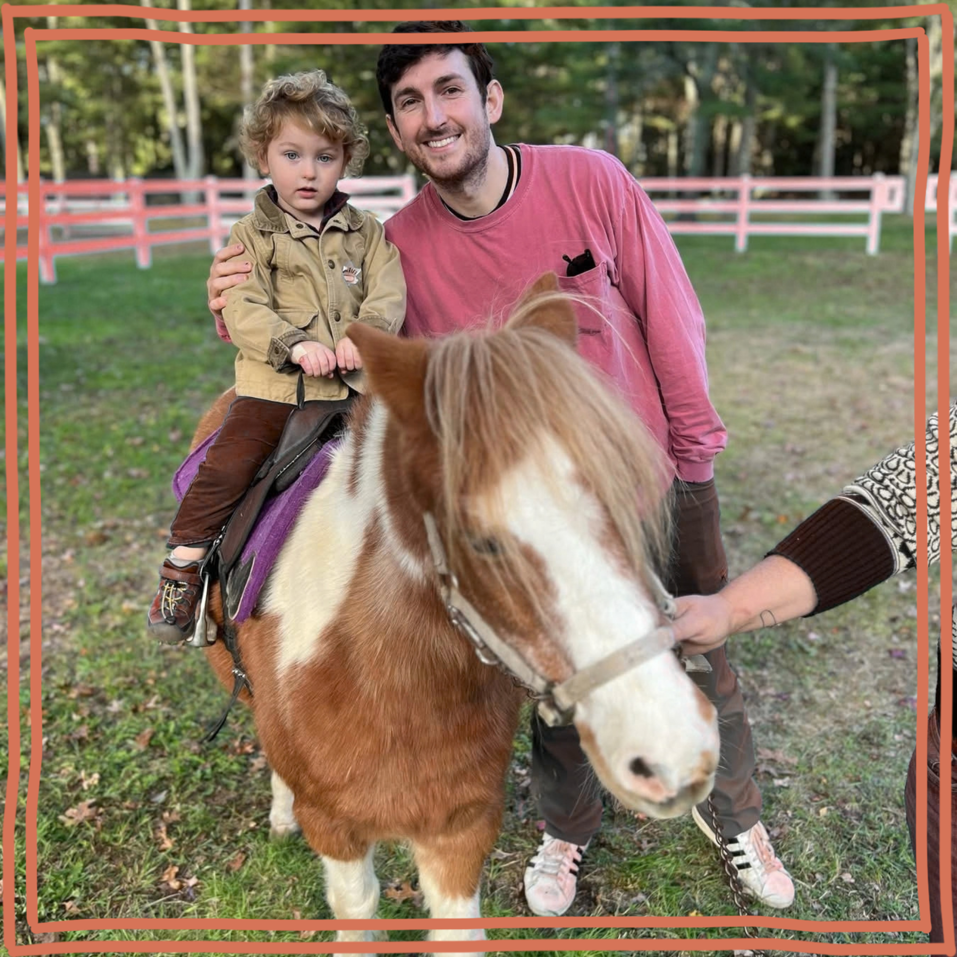 child riding a pony with dad by his side
