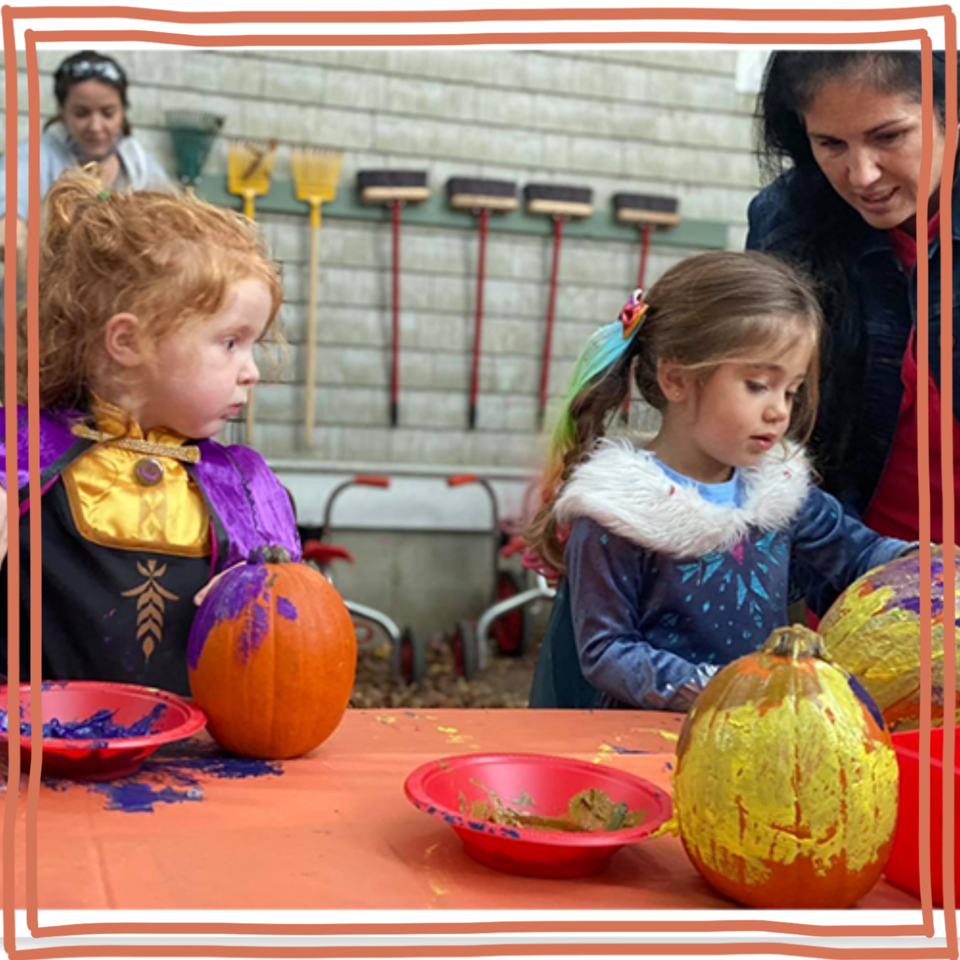 children decorating pumpkins