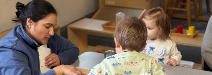 Montessori teacher working with students in the caregiver program. 