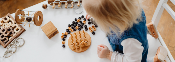 Why play is so important - a child playing with Montessori materials. 