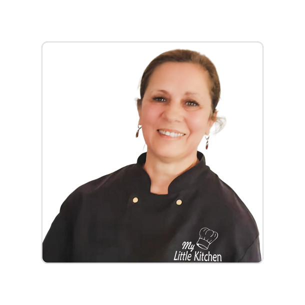Smiling chef in a black jacket on a white background