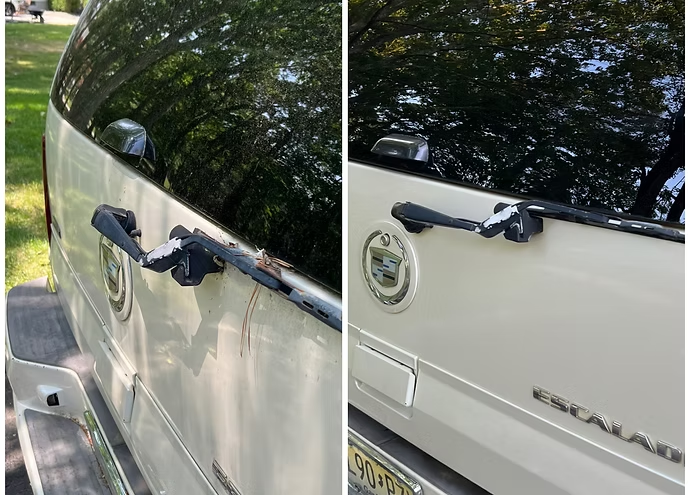 Close-up of a white car’s rear door with a damaged, broken side mirror and panel denting