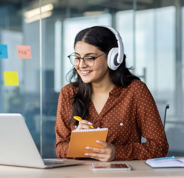 A young woman providing translation services during a call.