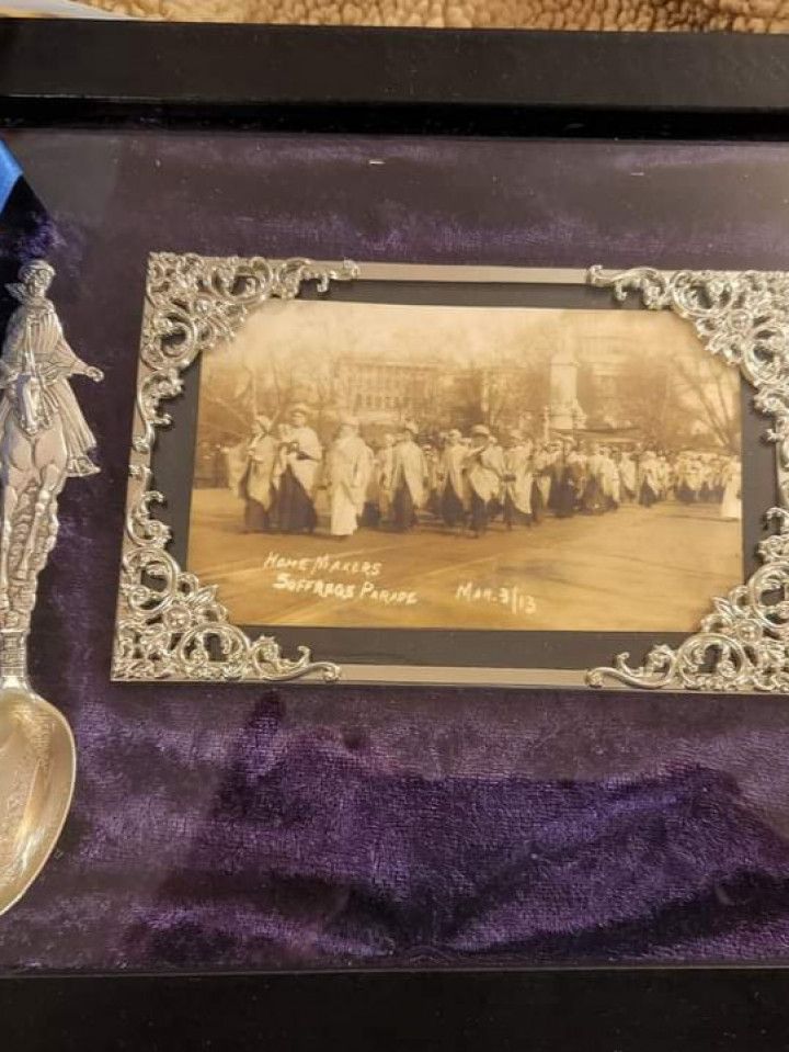 Antique photograph in silver filigree frame, with decorative spoon.