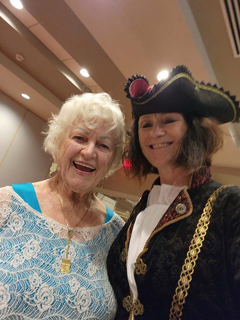 Two women smiling.