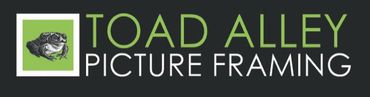 Logo for Toad Alley Picture Framing: green and white frog icon, green text, and dark background.