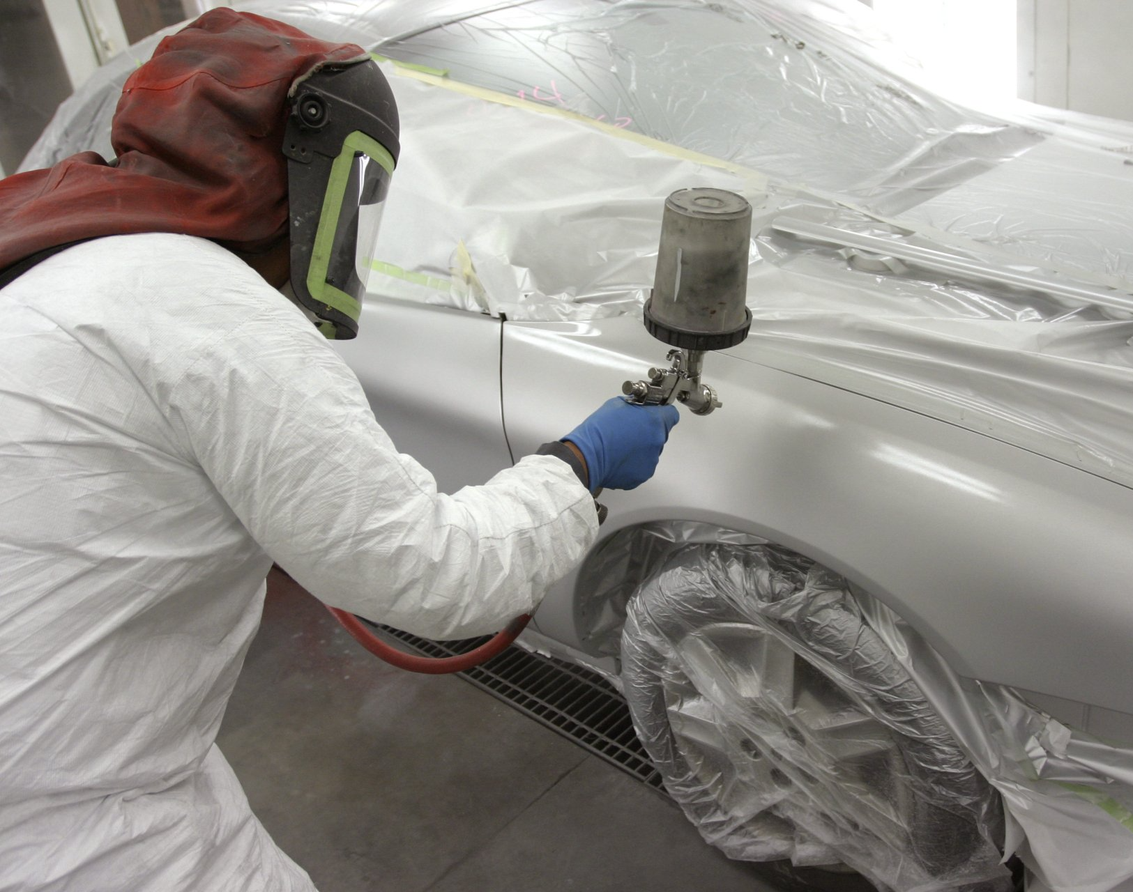 Man Replacing The Glass On Car - Mechanicsburg, PA - Sun Motors Collision Center