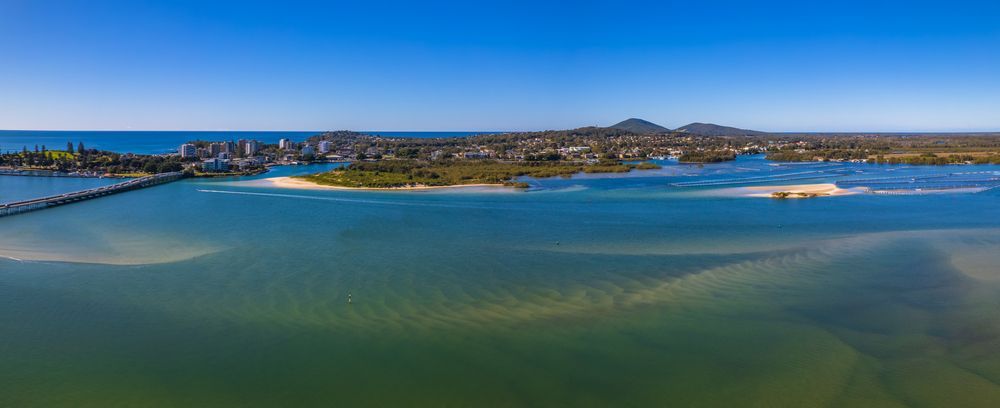 An Aerial View Of A Body Of Water With A City In The Background — BM Steel Fabrication In Tuncurry, NSW