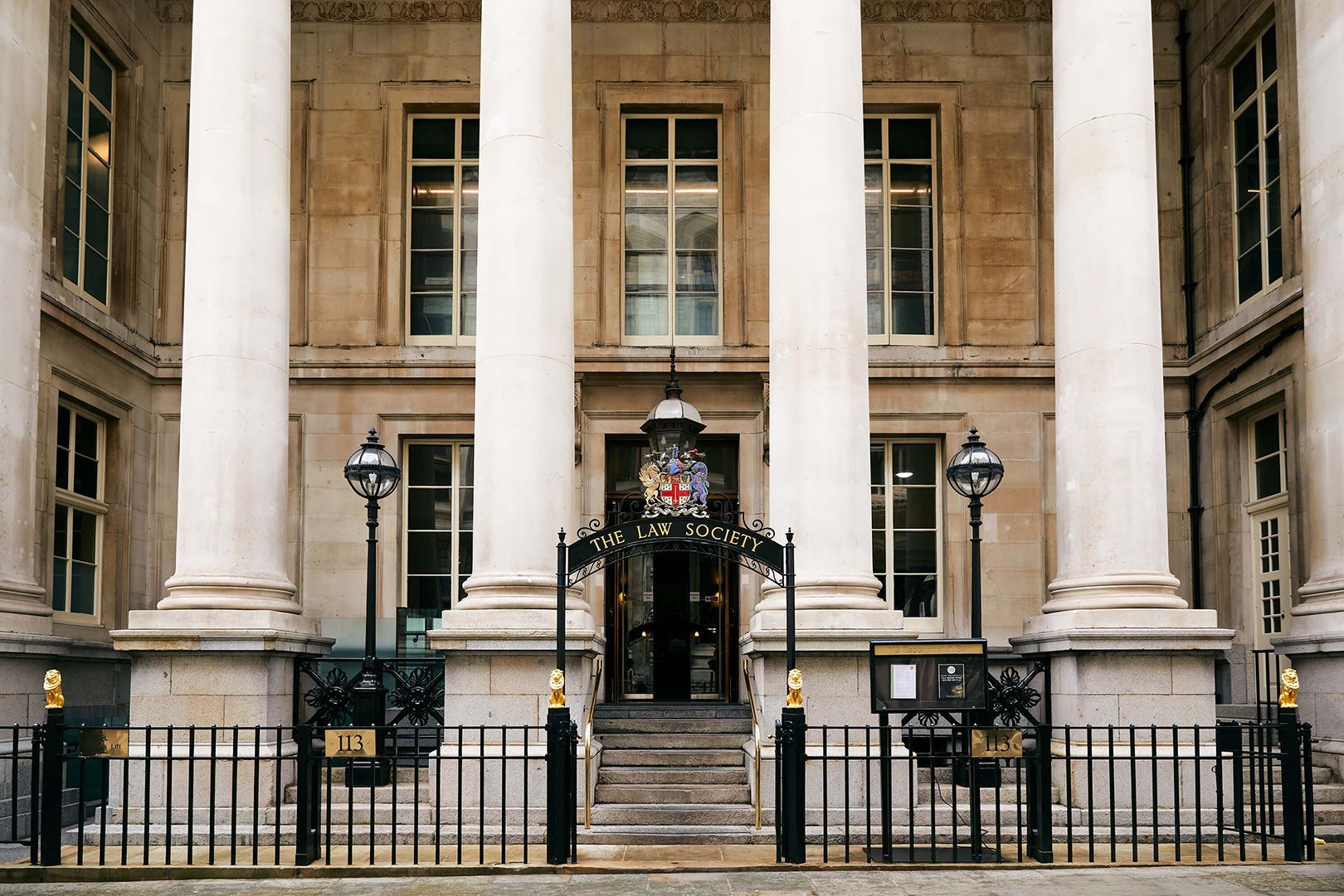 The front of a large building with columns and stairs