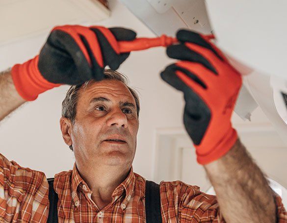 Worker Installing Air Conditioner — Honolulu, HI — Air Conditioning Experts