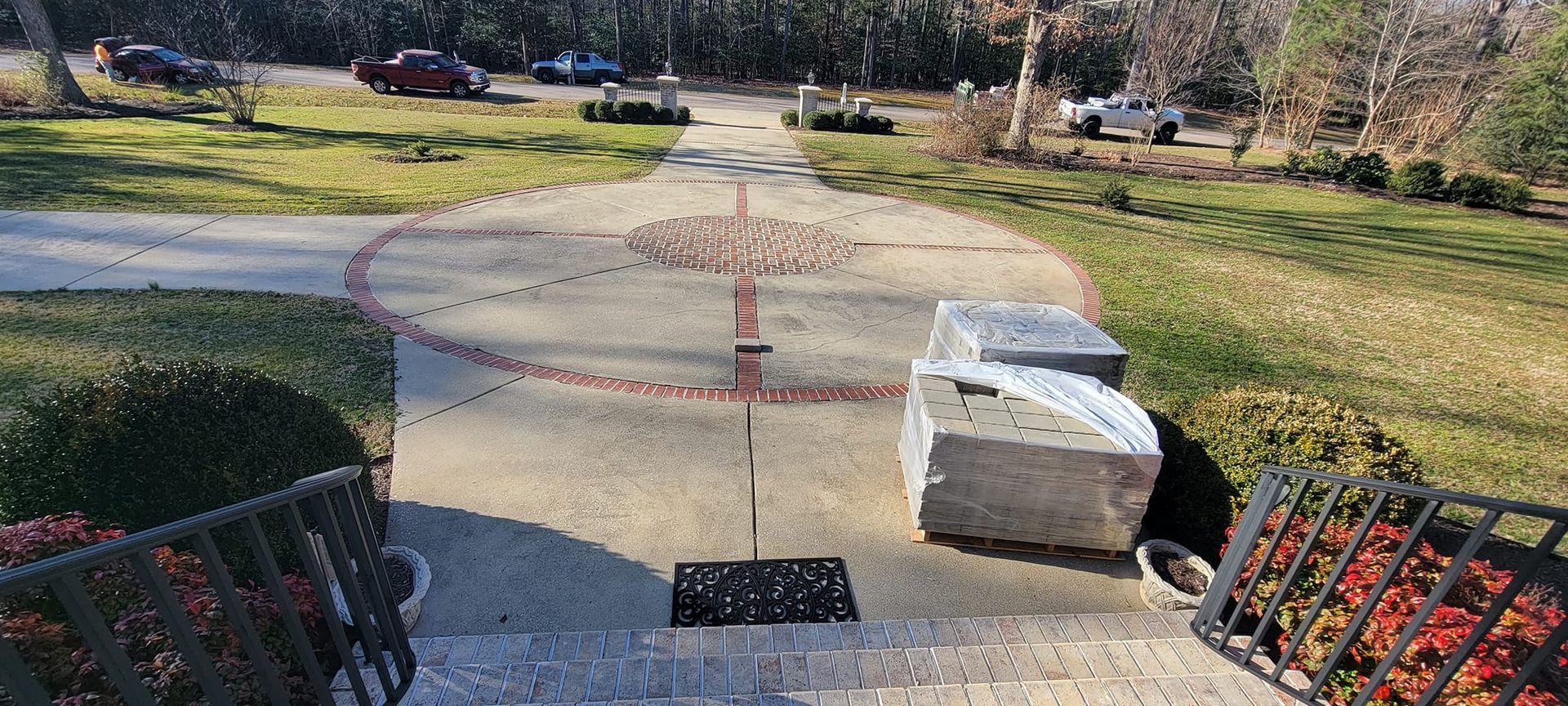 A concrete walkway with a compass in the middle of it.