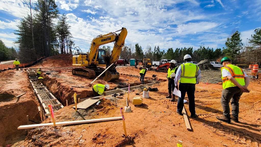 A group of construction workers are working on a construction site.