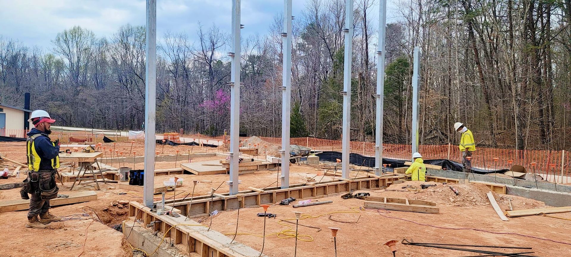 A group of construction workers are working on a construction site.