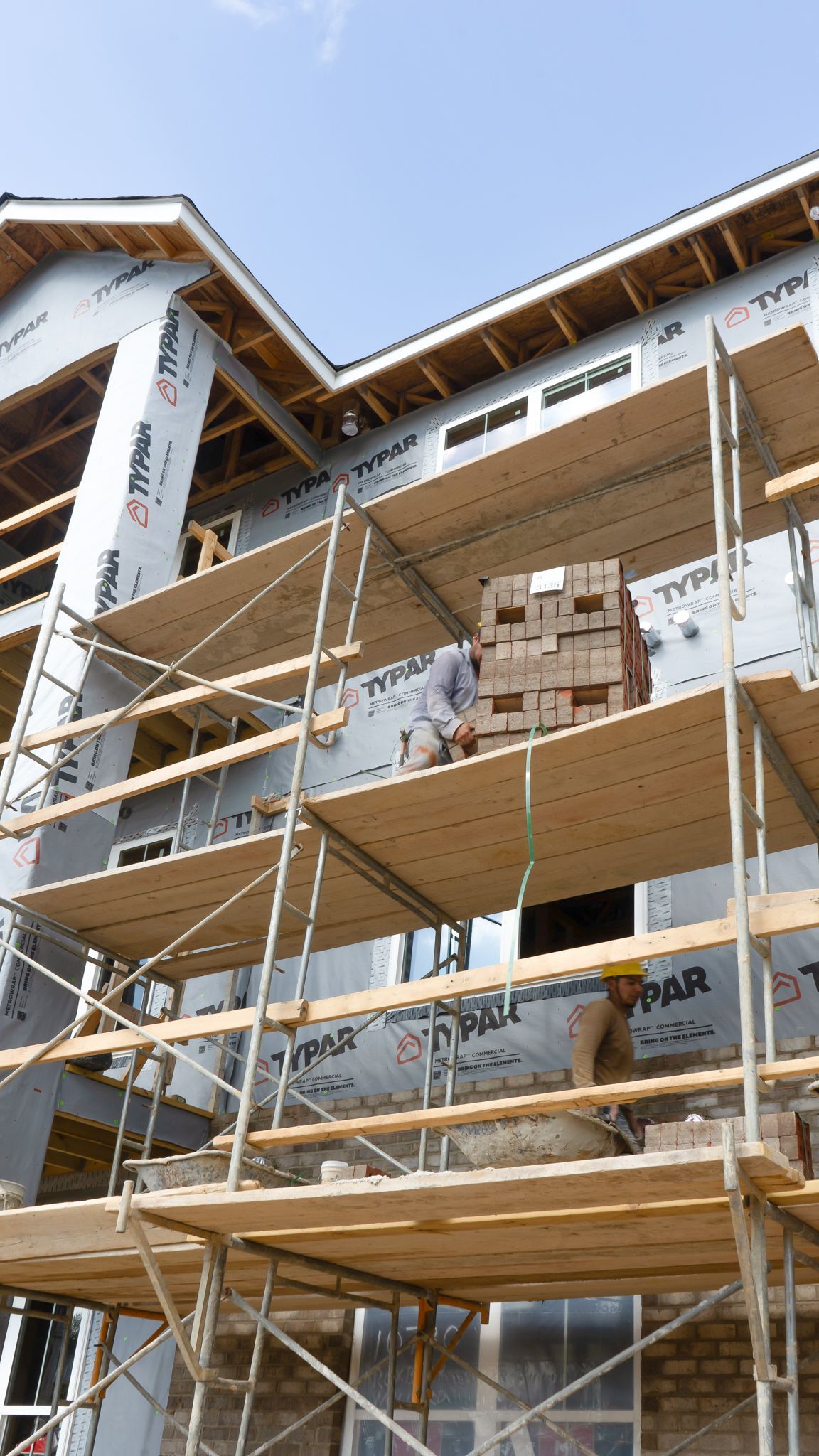 A building is being built with scaffolding around it.