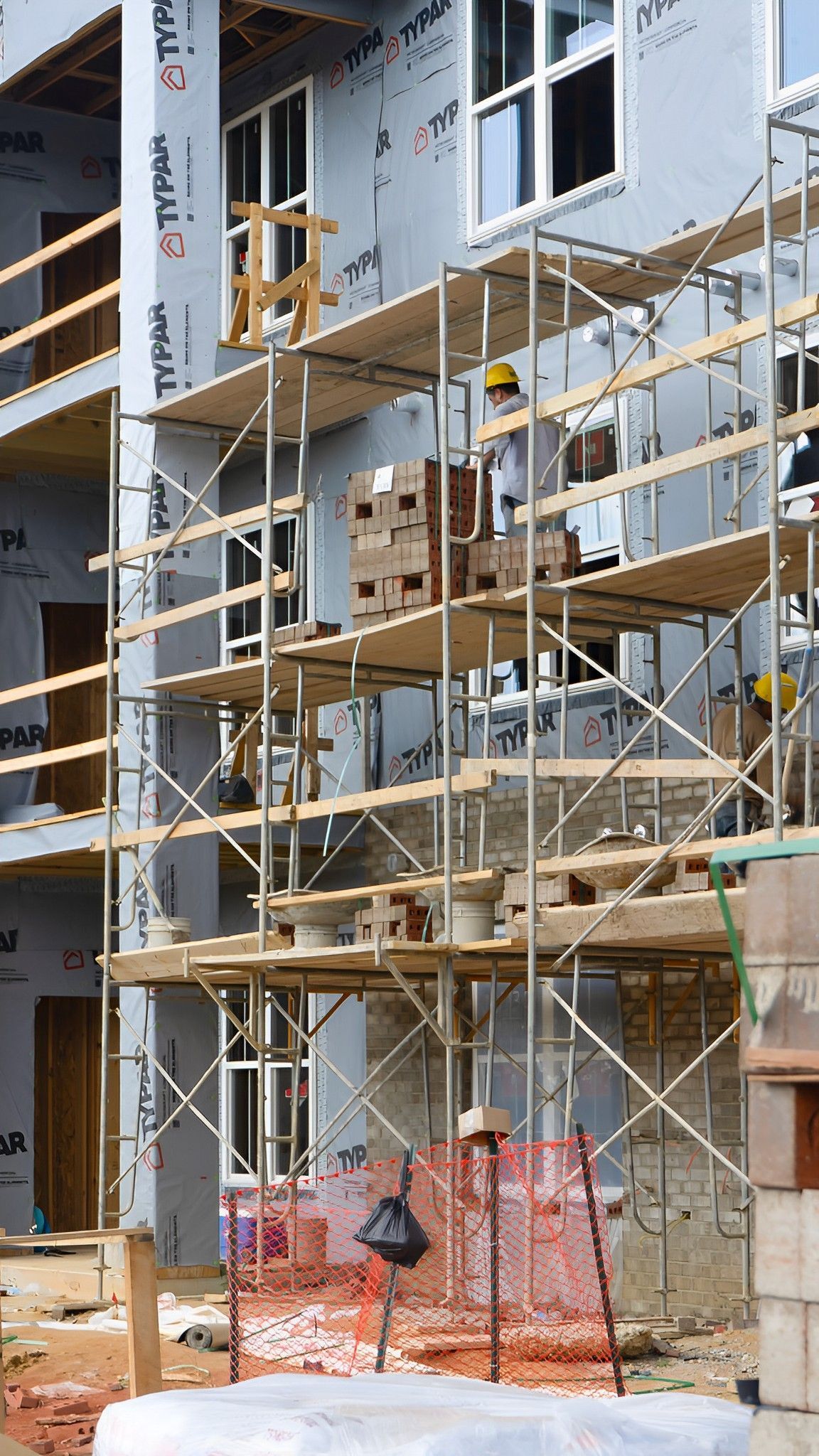 A building under construction with scaffolding on the side of it