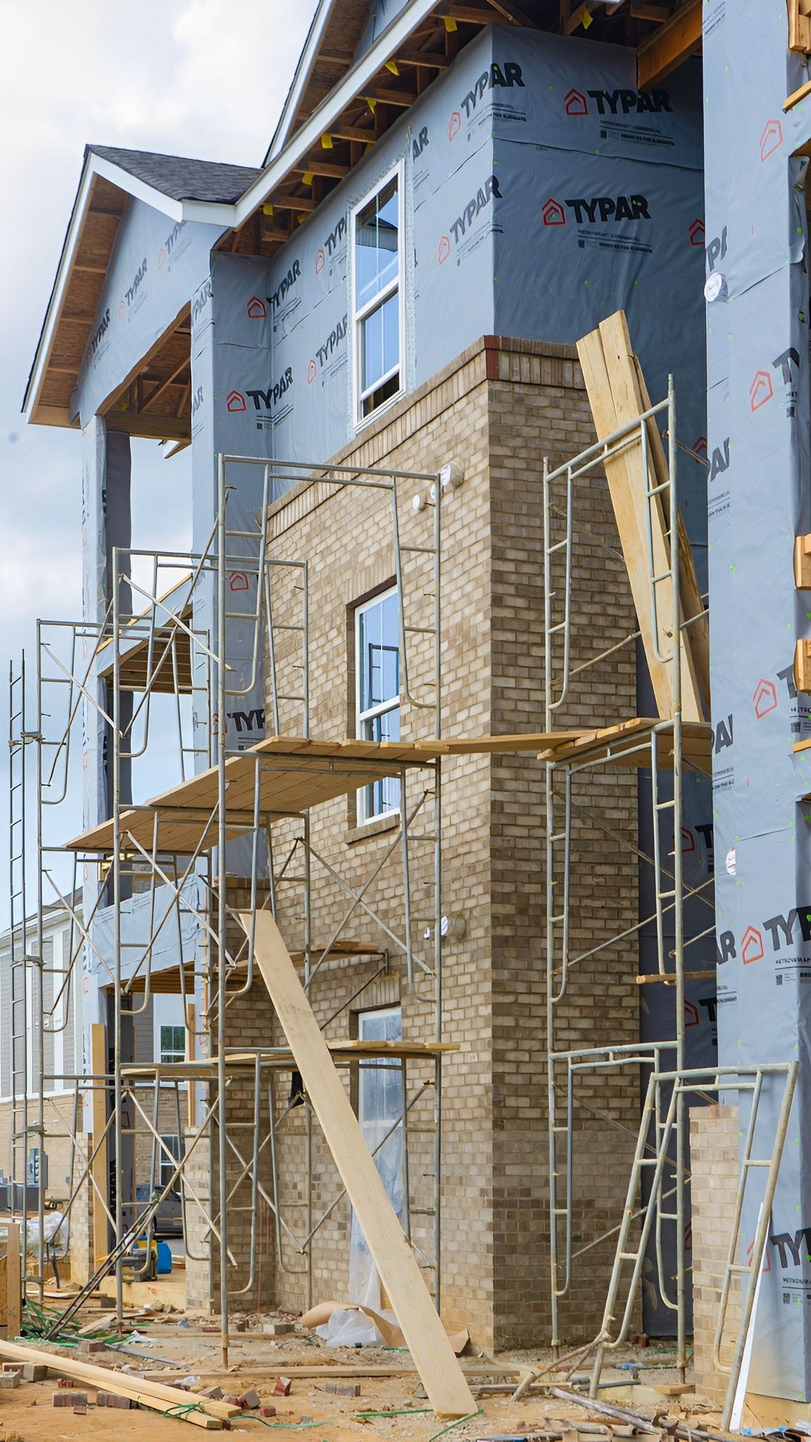 A house is being built with scaffolding around it.