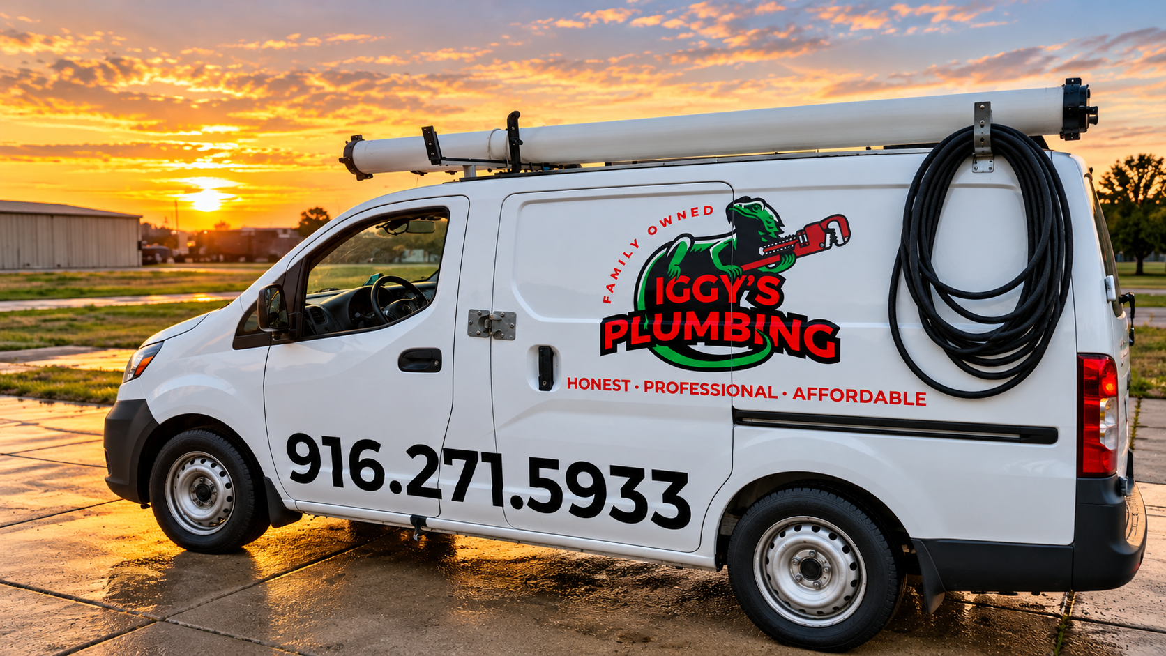 White McCoy Plumbing van with logo and phone number parked by a sunset waterfront.