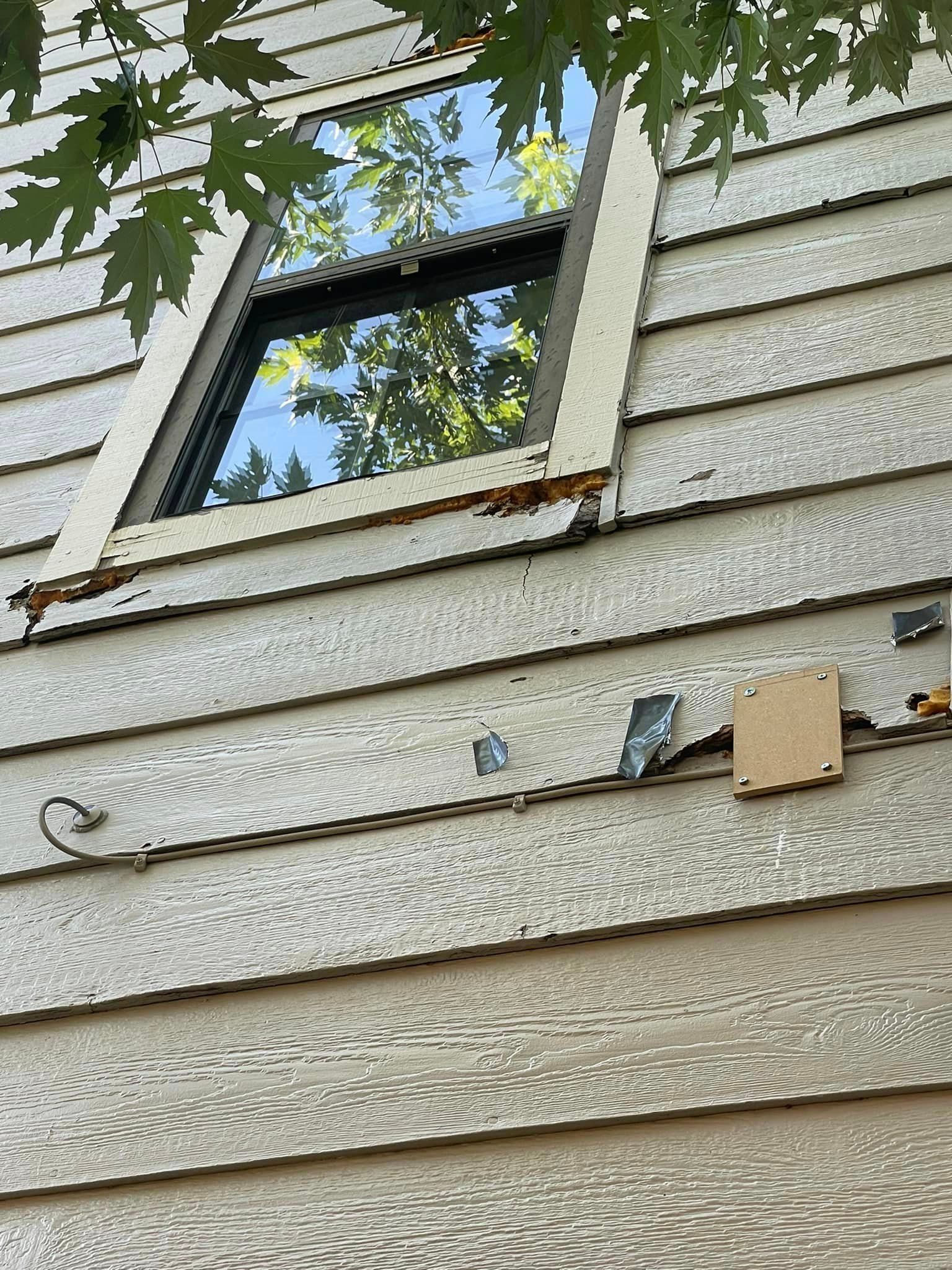 A close up of a window on the side of a house.