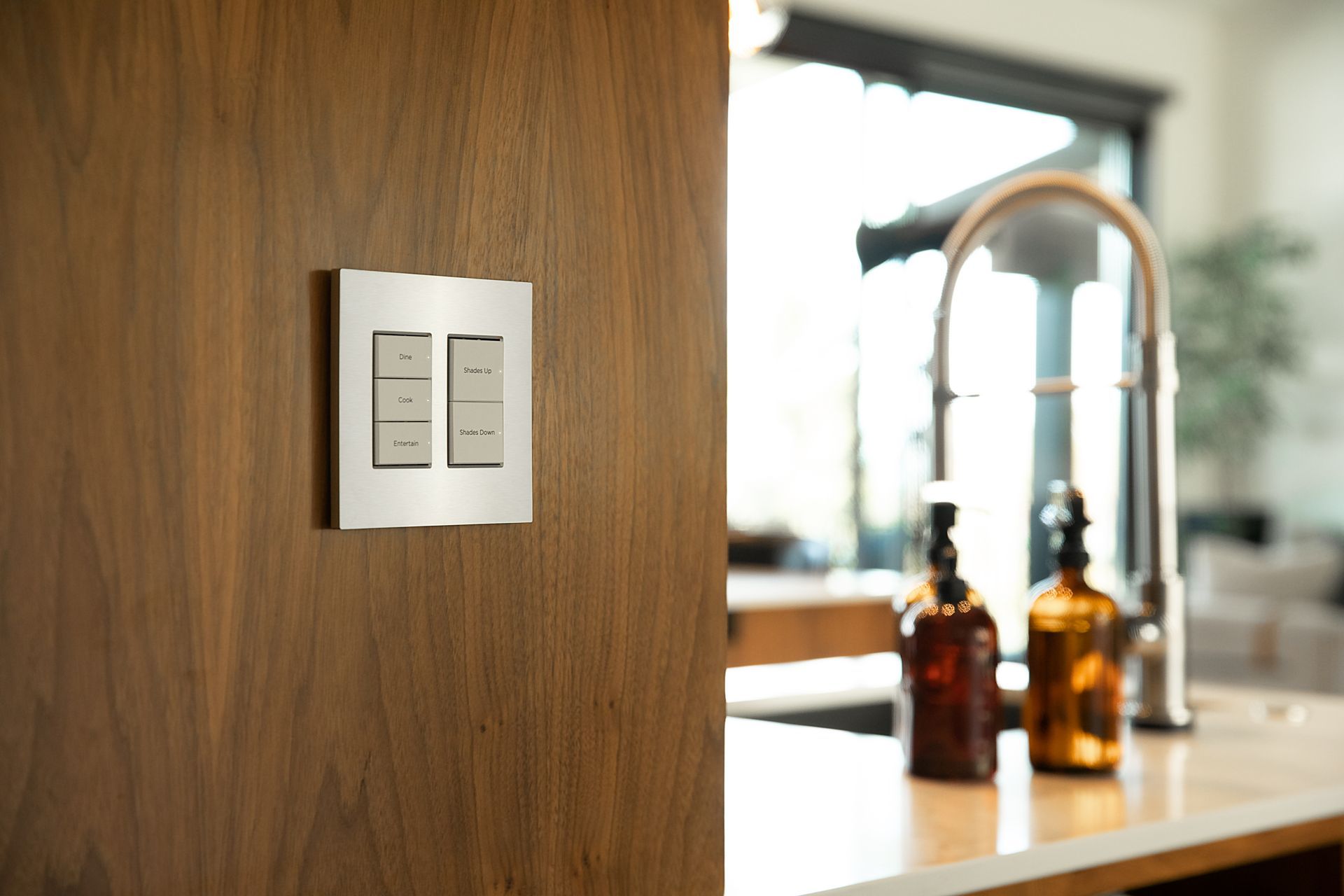 A kitchen with a sink and a light switch on the wall Premier Lighting & Home Automation