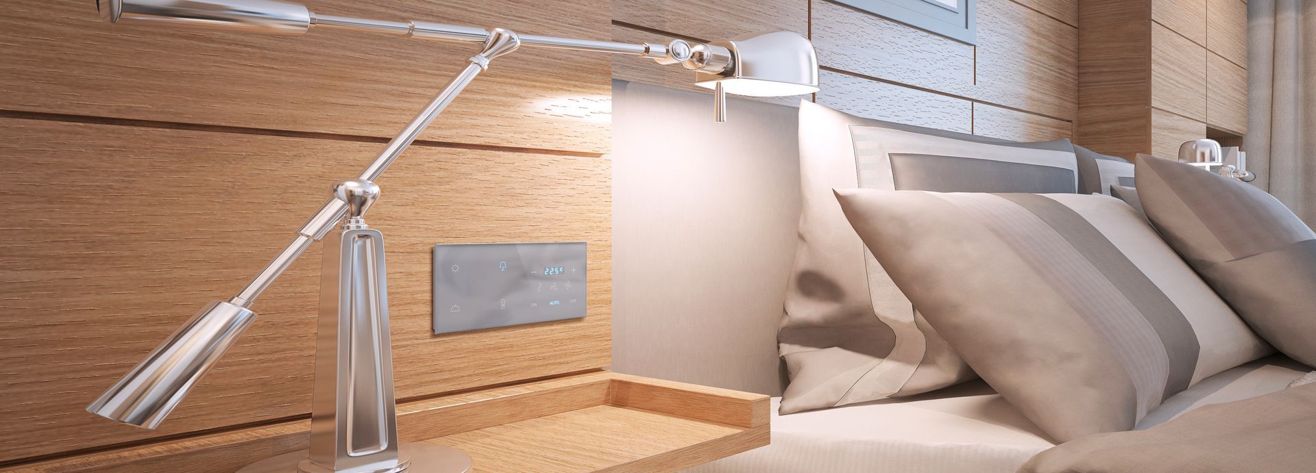A bedroom with a bed and a lamp on the nightstand.