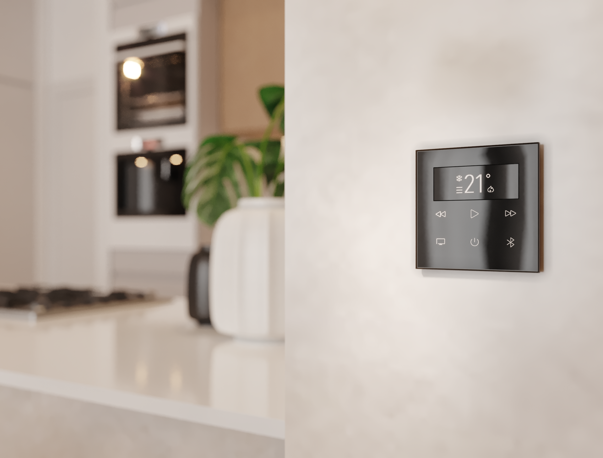 A black thermostat is mounted on a white wall in a kitchen.