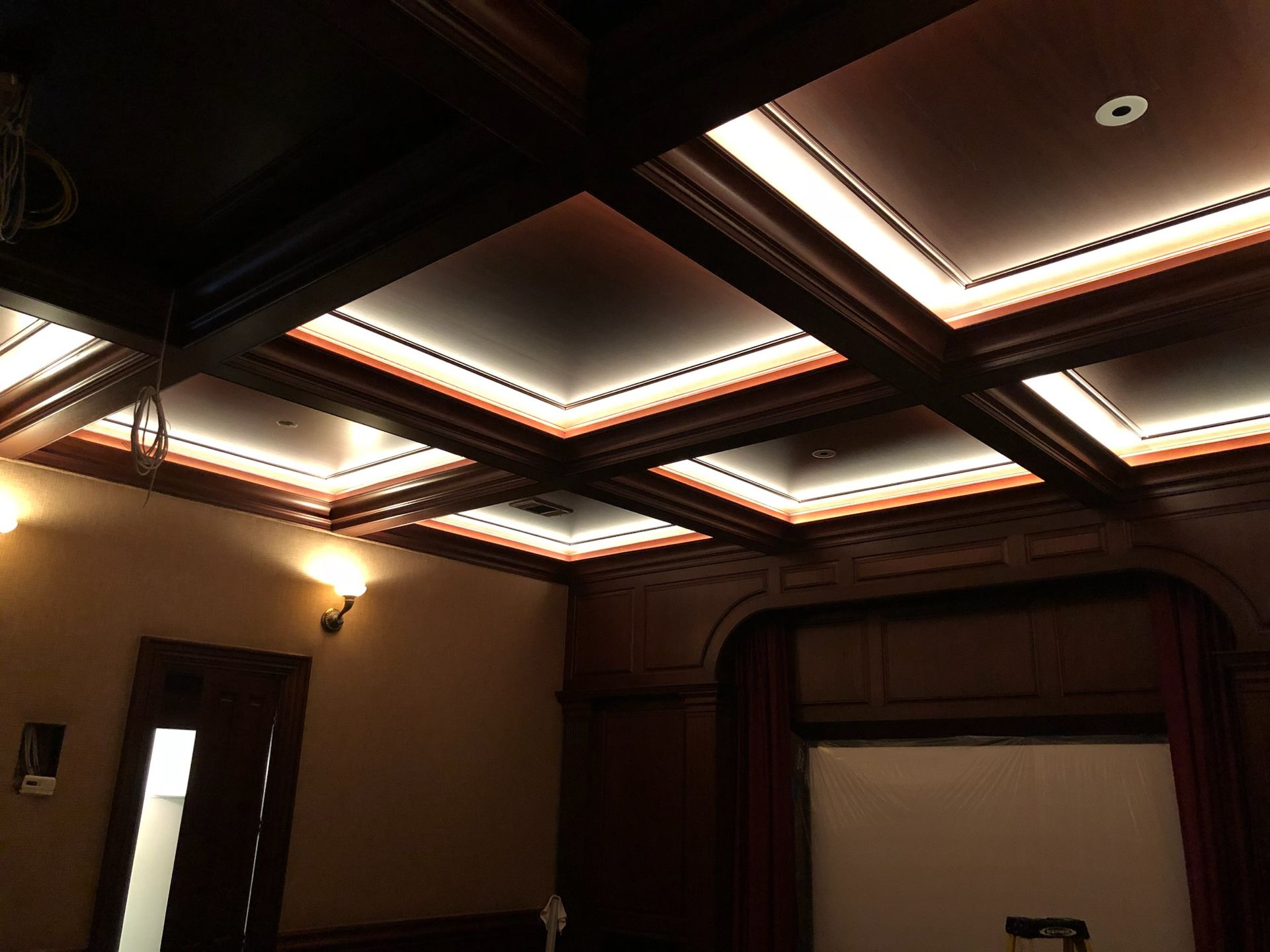 A dark room with a ceiling that has lights on it,   Premier Lighting & Home Automation, LLC in Dallas Fort Worth (DFW).