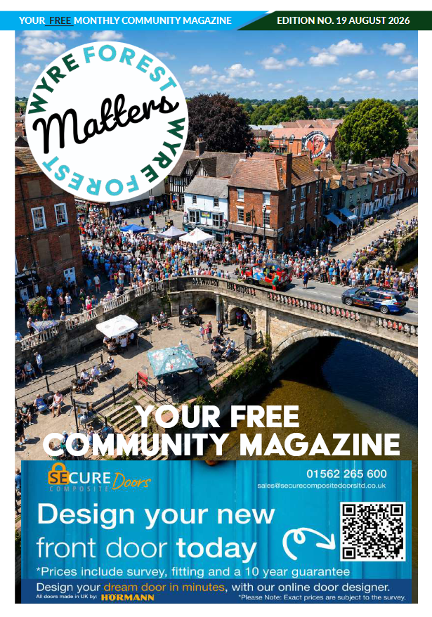 A busy summer scene showing the riverside as Bewdley Carnival progresses across the bridge.