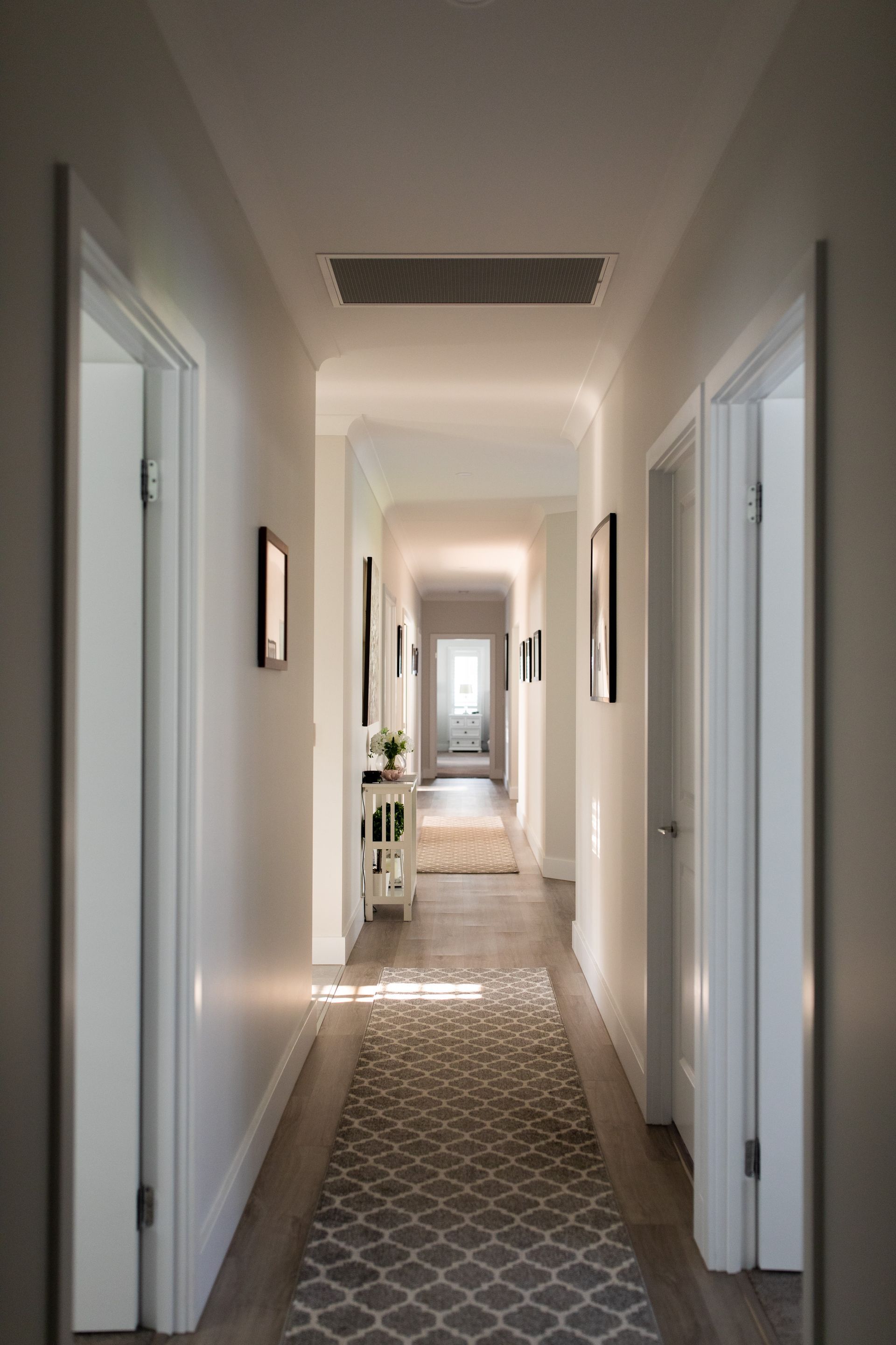 A Long Hallway With Light Grey Walls — Michael Duncan Constructions Pty Ltd in Robina, QLD