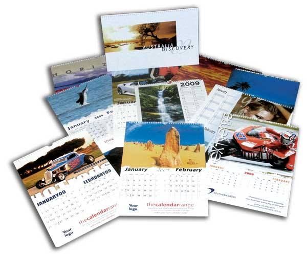 A bunch of calendars are laying on top of each other
