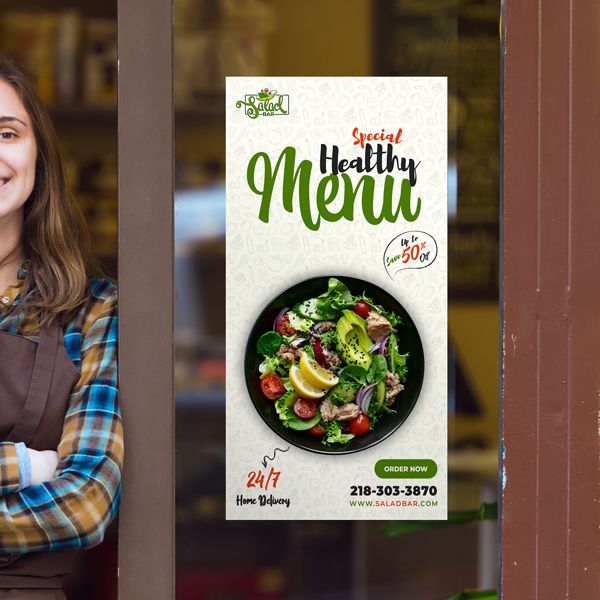 A woman is standing in front of a sign that says special healthy menu
