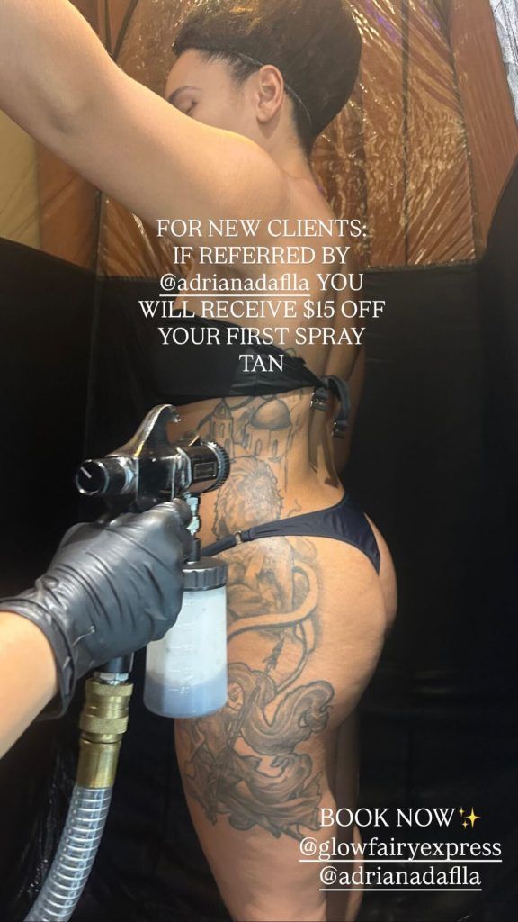 A person receiving a spray tan on their side, with text offering $15 off for new clients referred by @adrianadalla.