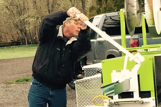 Man Arranging Gutter — Springfield, OR — American Seamless Guttering