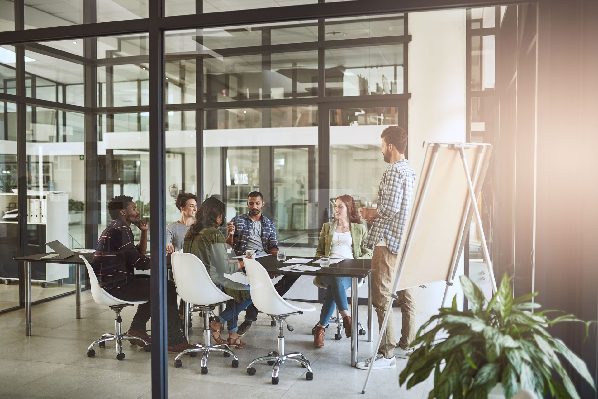 A group of people are having a meeting in an office.