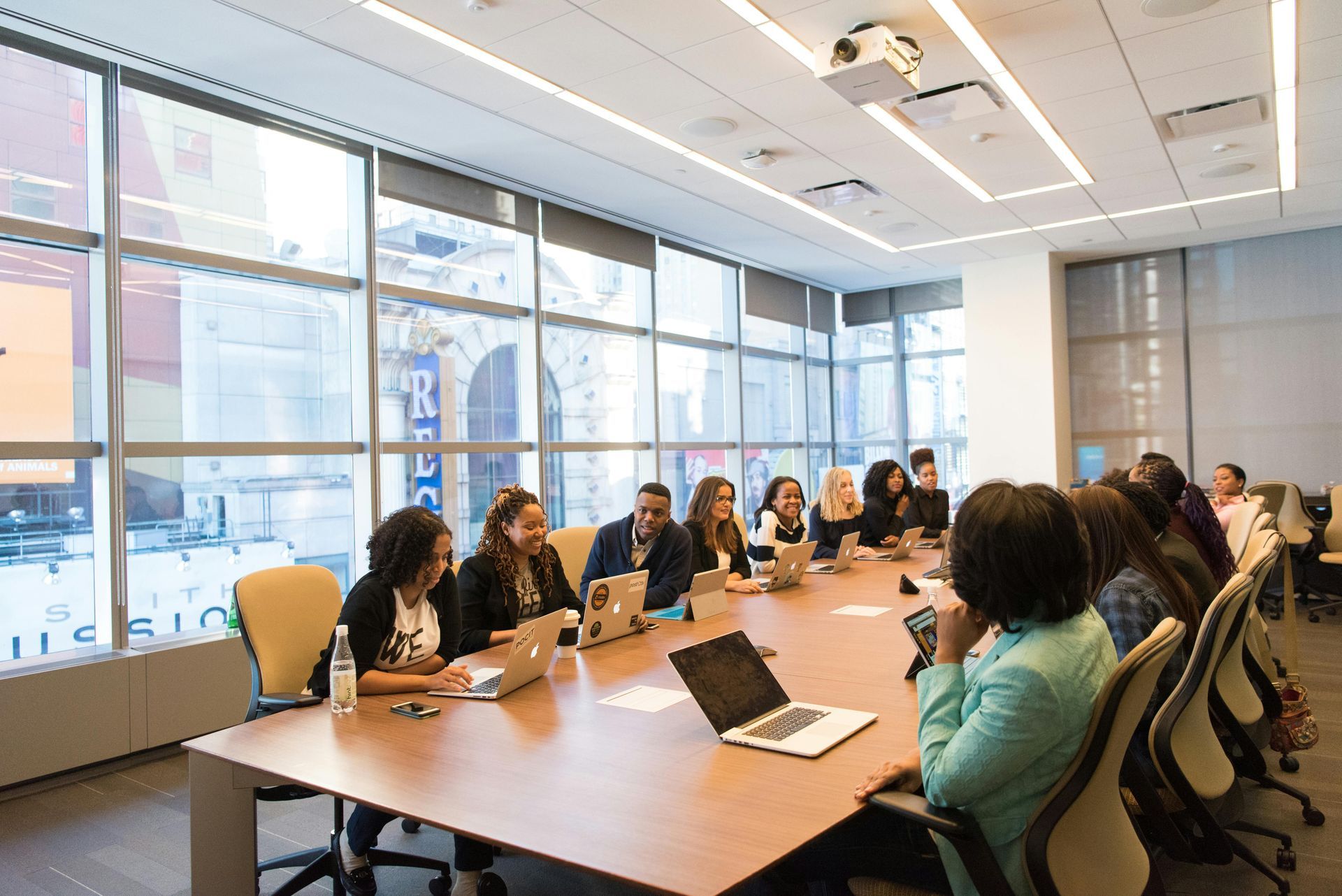 people sitting across a meeting table