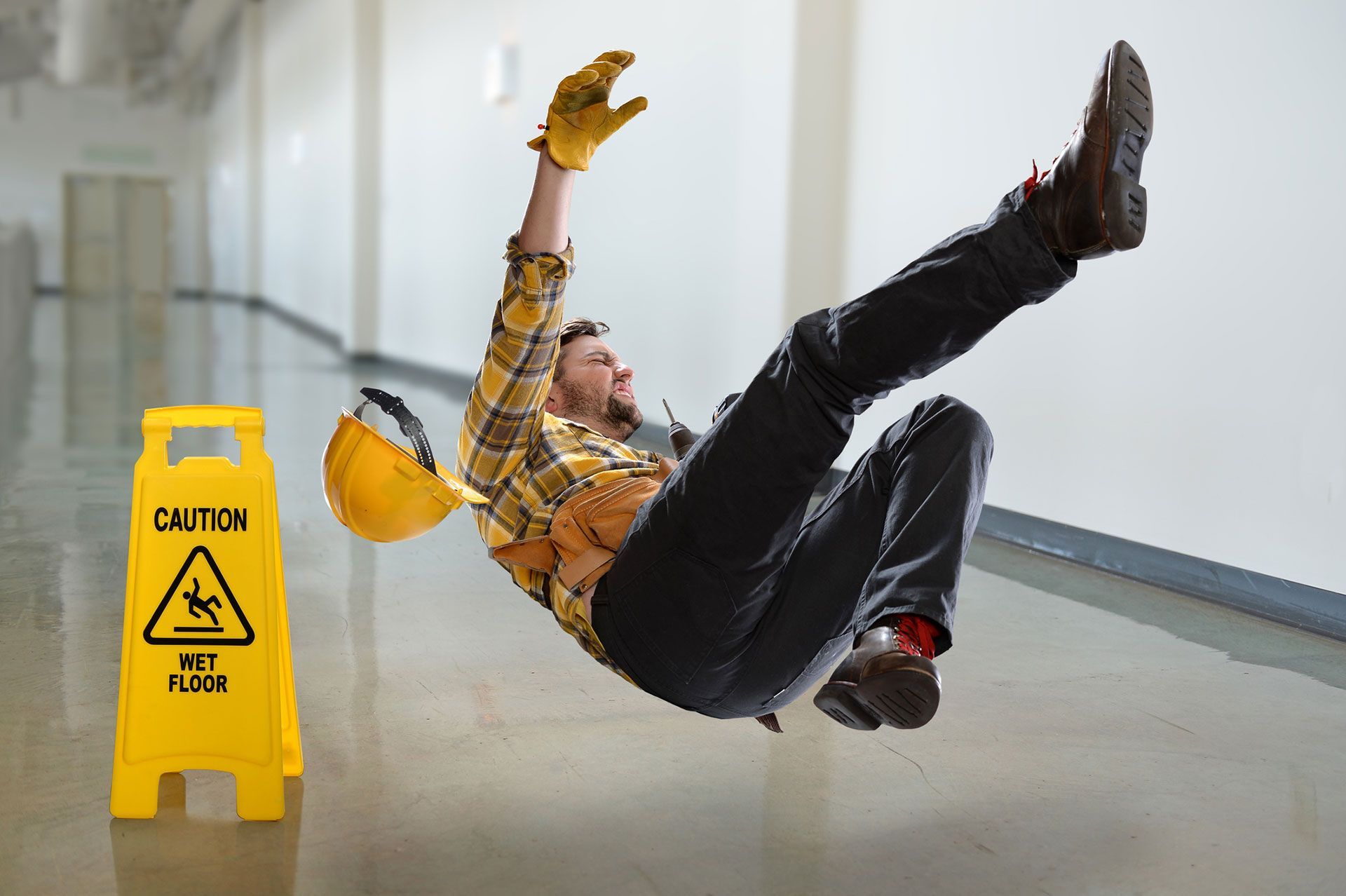 A man slipping on a wet floor