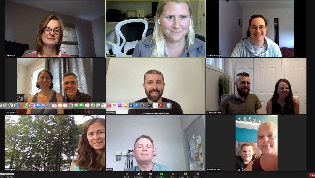 A group of people are having a video call on a computer screen.