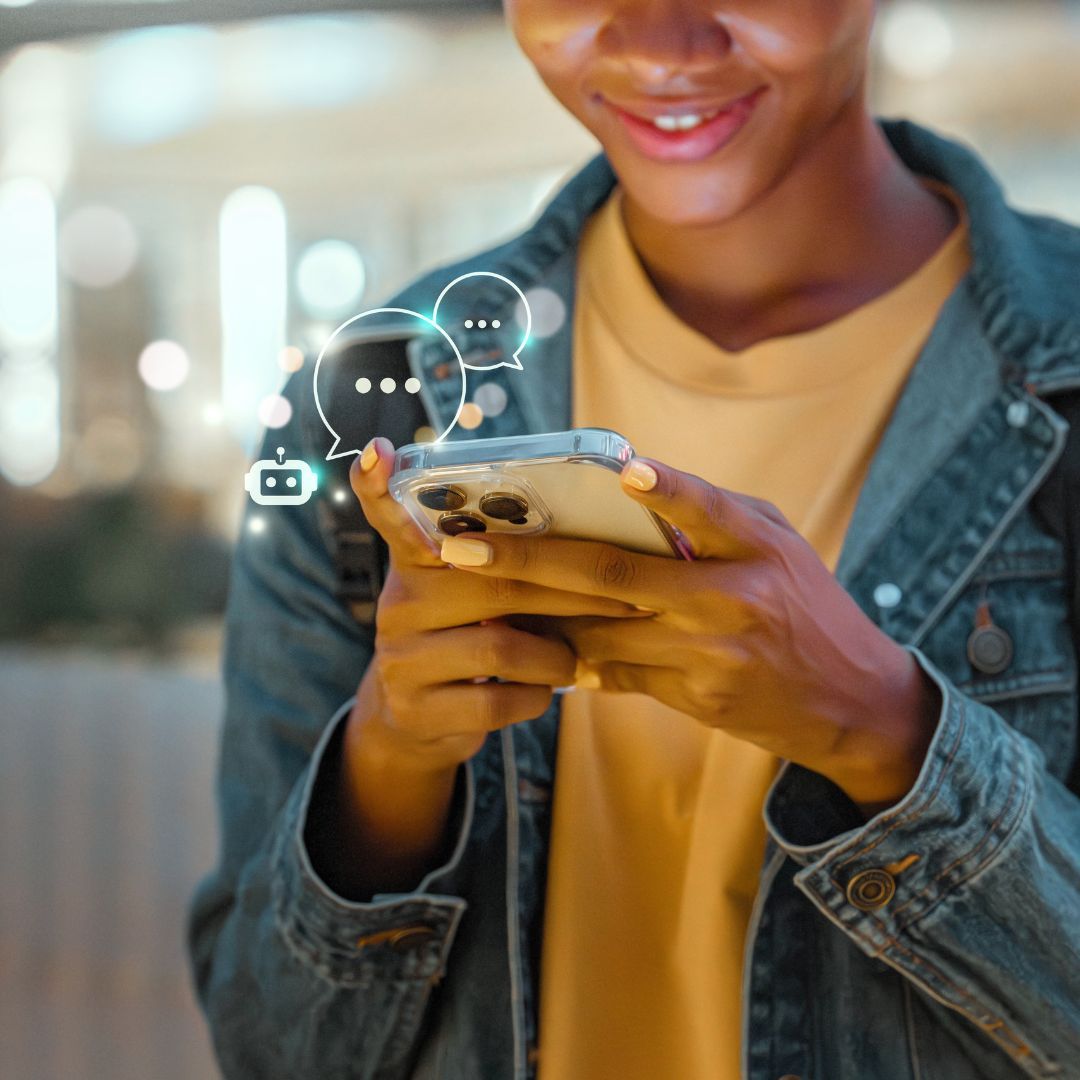 Person smiling, looking at smartphone, speech bubble icons floating above the screen.
