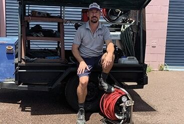Glen with Drain Jetter Trailer — Plumbers & Gas Fitters in Coconut Grove, NT