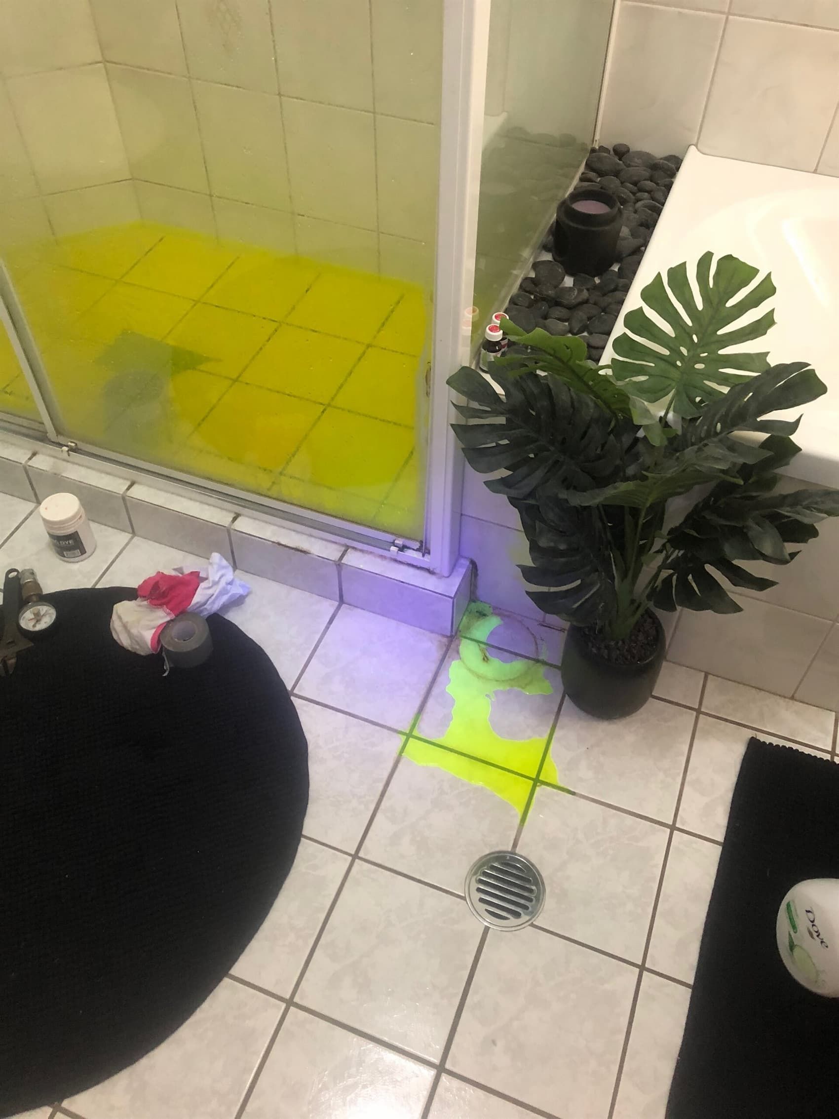 A Bathroom with A Yellow Shower and A Black Rug — Plumbers & Gas Fitters in Coconut Grove, NT