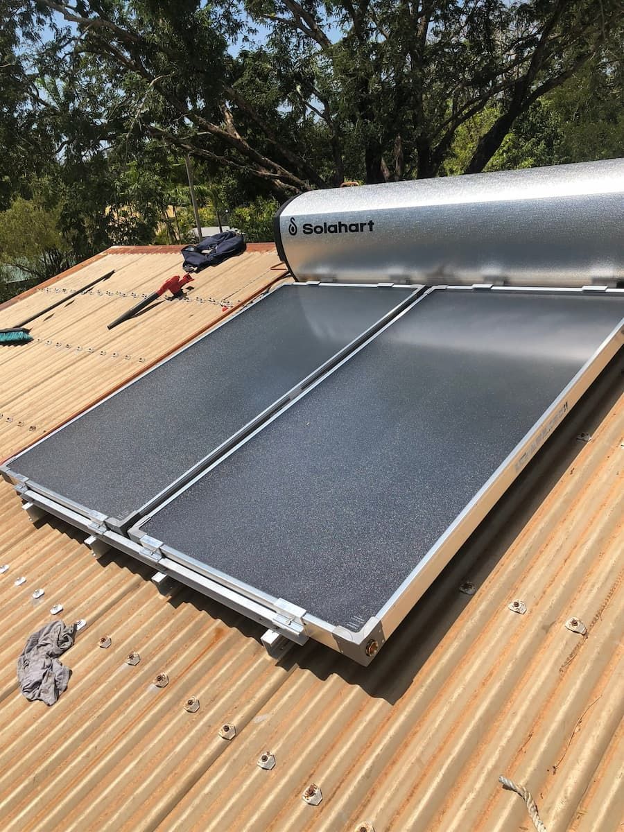 A Solar Water Heater is Sitting on top of a Roof — Plumbers & Gas Fitters in Coconut Grove, NT
